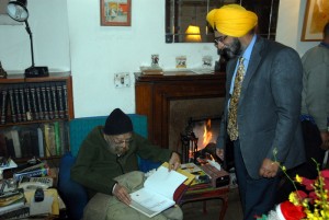 Presenting an advance copy of Sikh Heritage: Ethos and Relics to Khushwant Singh