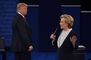 Hillary Clinton speaks while Donald Trump glowers during a televised debate. 